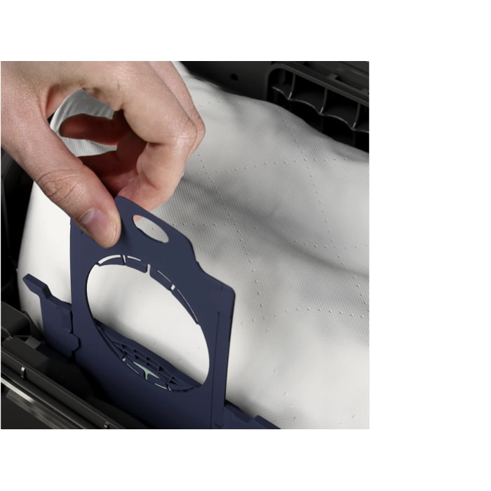 Showing the easy bag exchange. hand changing the s-bag in vacuum cleaner.